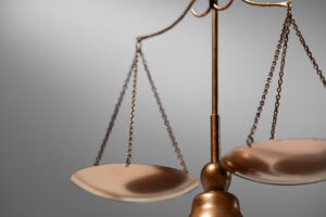 An old-fashioned two-way scale symbolizing legal balance, fairness, and antitrust justice